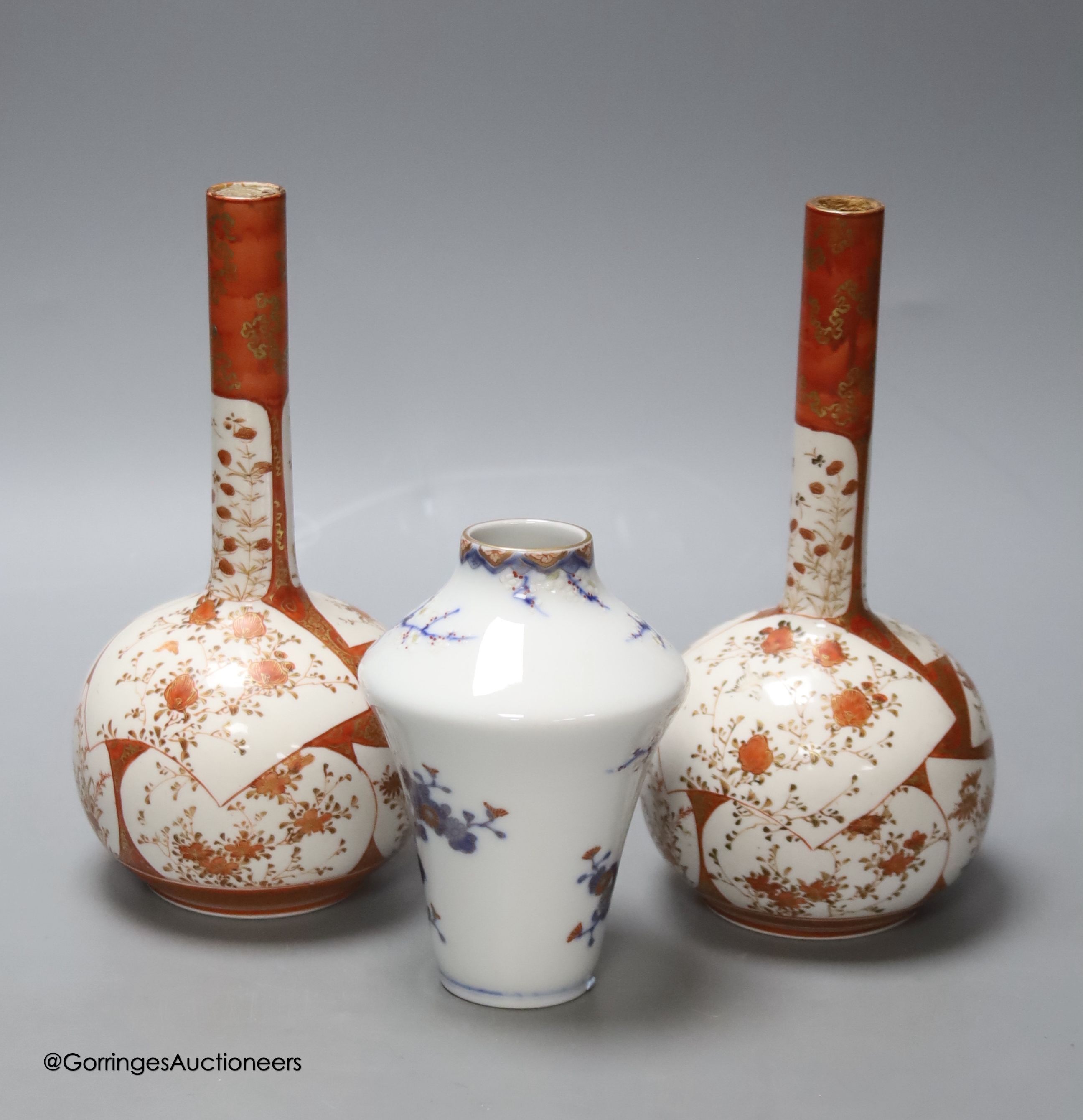 A Japanese porcelain vase, by Fukugawa and two Kutani bottle vases, height 21cm